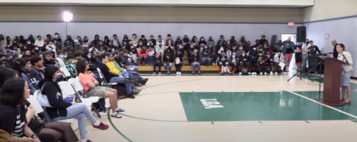 Students in gym for conference